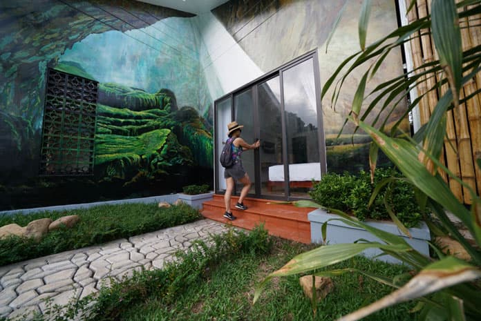 Artworks on the walls in front of each room in Son Doong Bungalow.