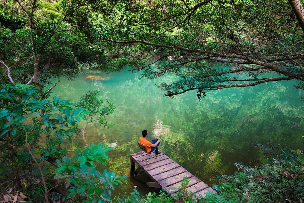 Enjoy the tranquility by the turquoise lake at Hung Dung Campsite.