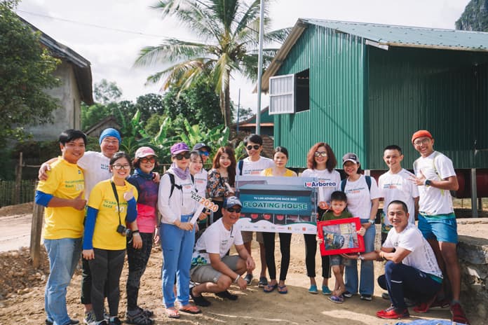 Handing out the floating house for Tan Hoa villagers.