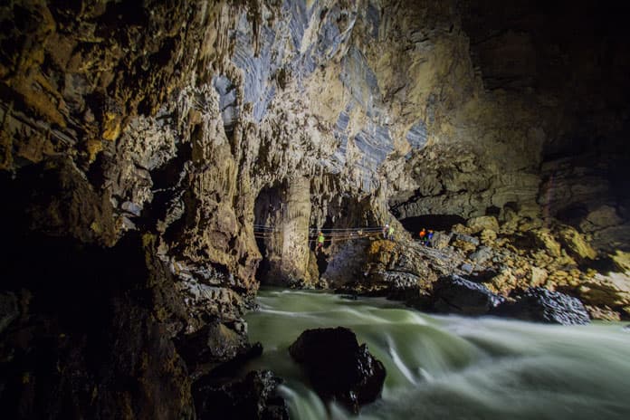 Experience zip-lining in Hang Tien Cave, the largest dry cave in the Tu Lan Cave System 
